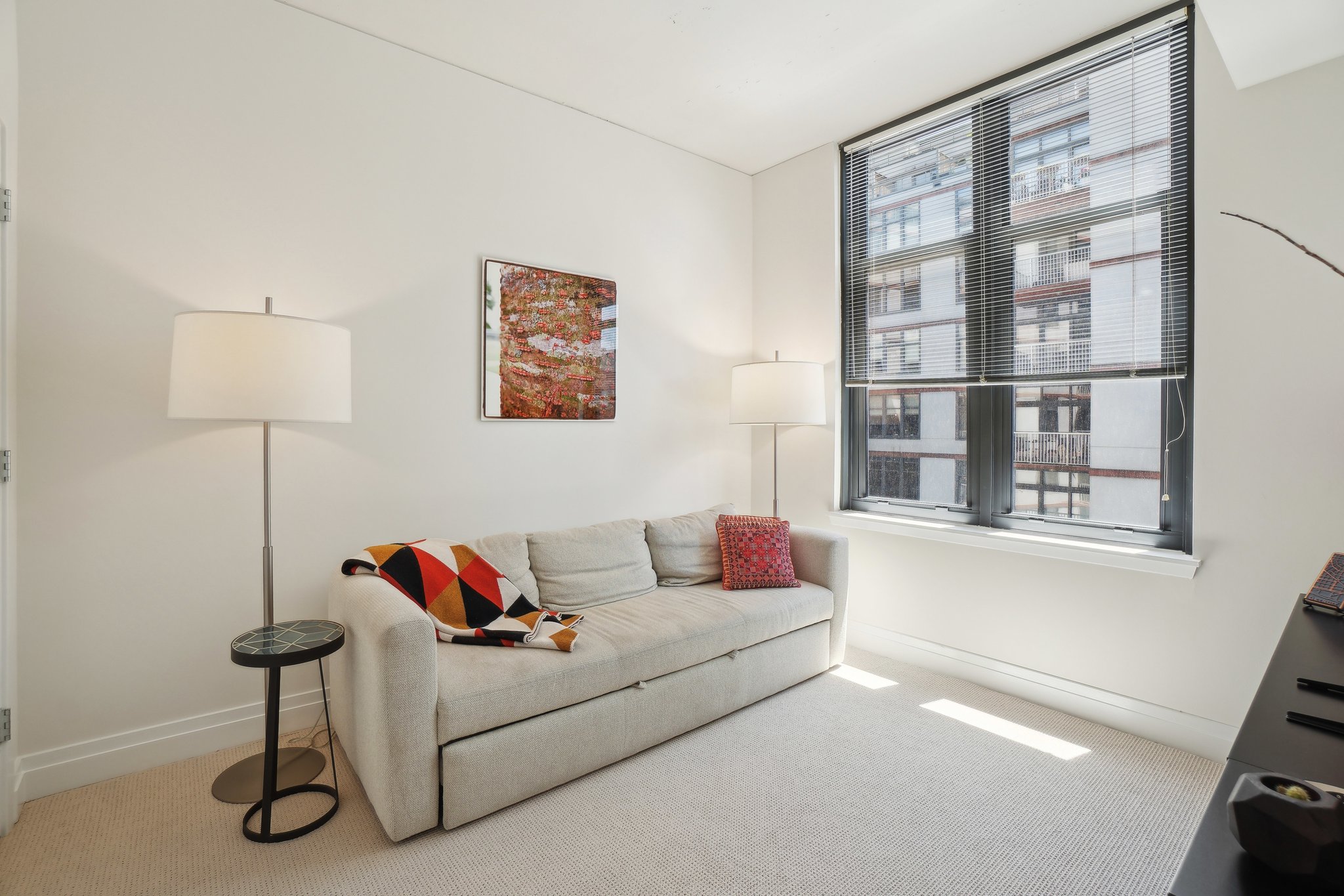 2120 Vermont Avenue Northwest, Unit 309 Washington, DC 20001 - Photo 17 of 26 a living room with furniture and a window