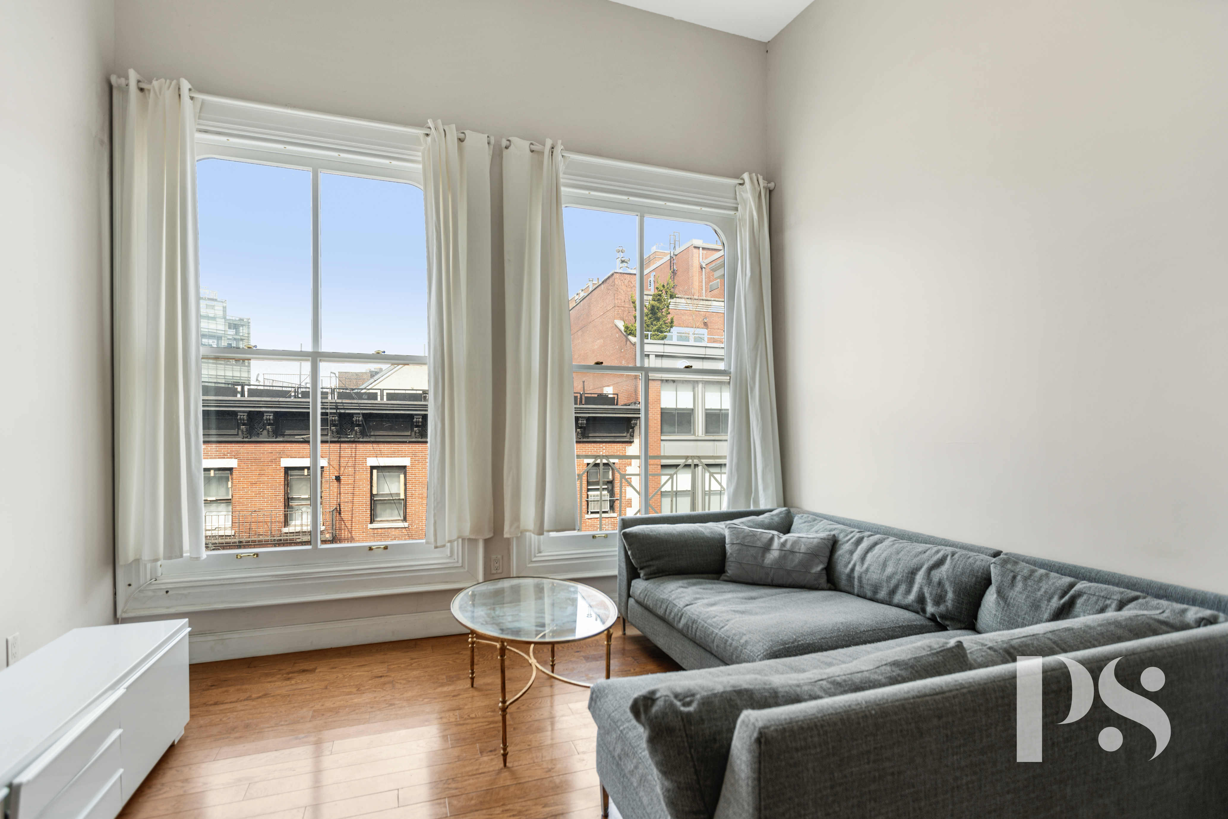 2 Wooster Street, Unit 5A Manhattan, NY 10013 - Photo 3 of 12 a living room with furniture and a window