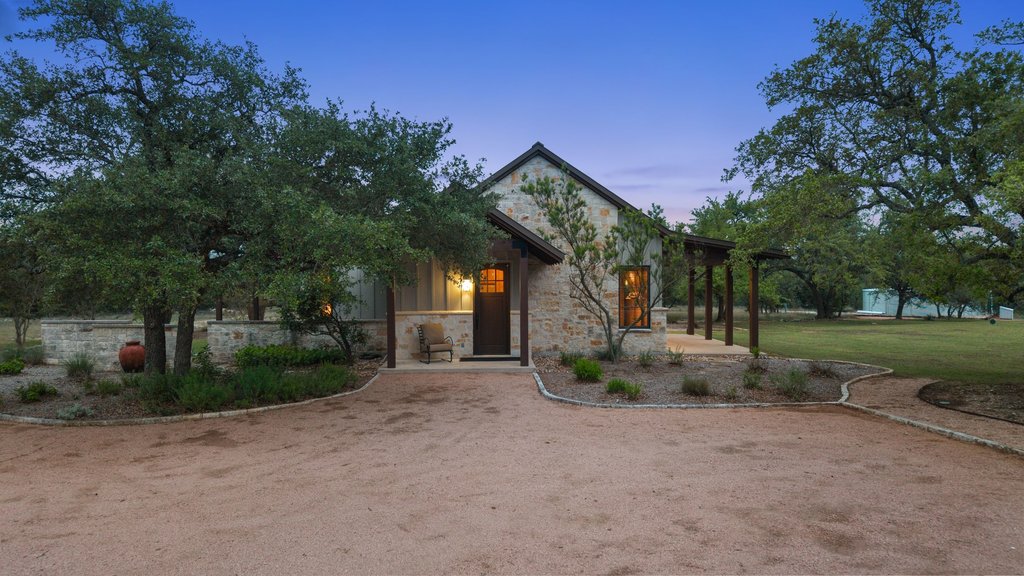 2560 Bell Springs Road Dripping Springs, TX 78620 - Photo 21 of 42 a view of a house with a park