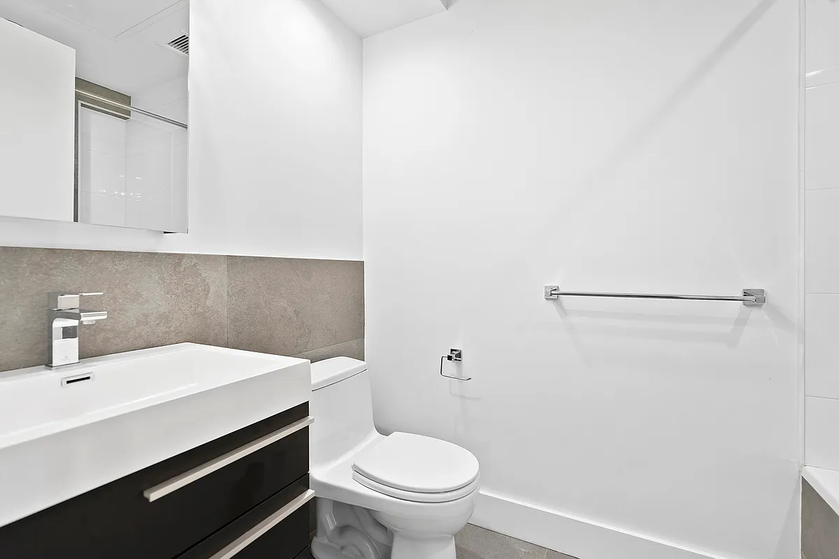 340 14th Street, Unit 2L Brooklyn, NY 11215 - Photo 5 of 9 a bathroom with a sink and a toilet