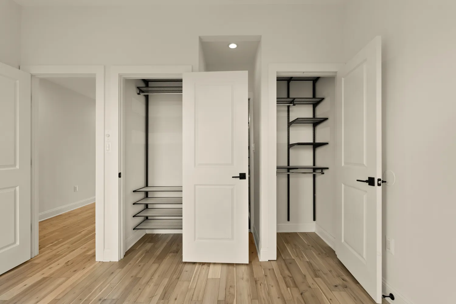 a view of a balcony with floor to ceiling windows with wooden floor