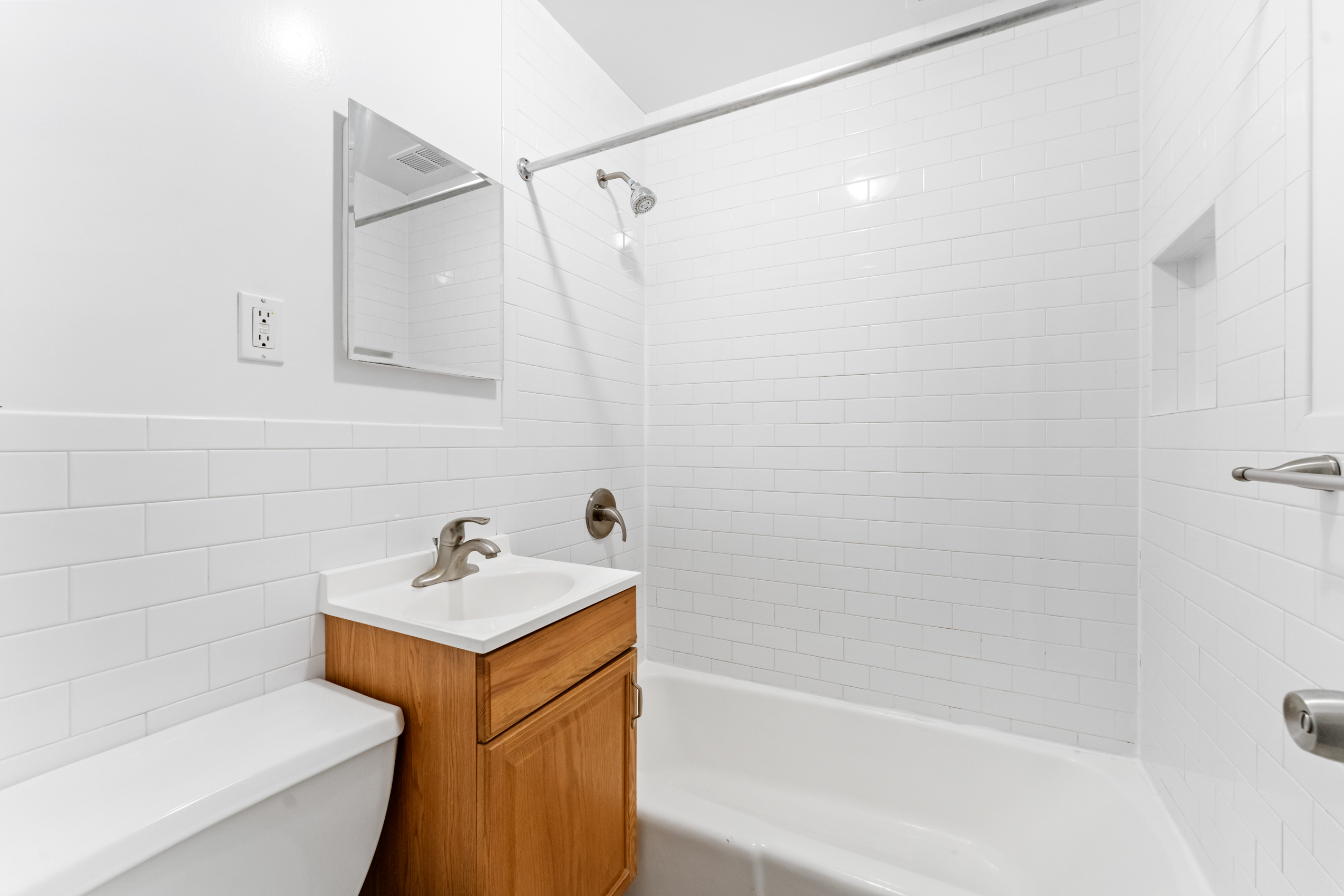 482 East 74th Street, Unit 5C Manhattan, NY 10021 - Photo 6 of 8 a bathroom with a sink a toilet and shower