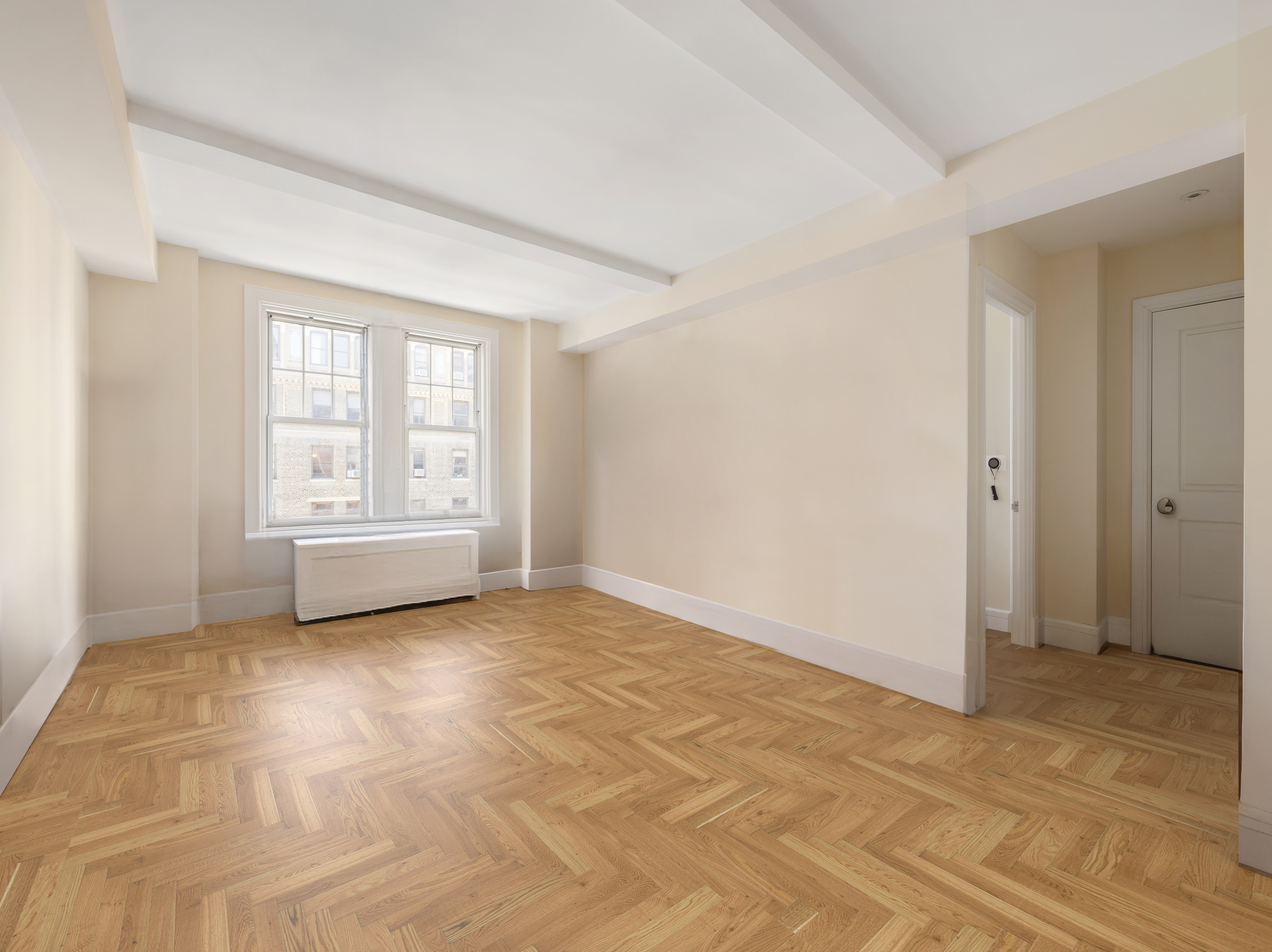 27 West 72nd Street, Unit 1403 Manhattan, NY 10023 - Photo 4 of 18 a view of an empty room with a window