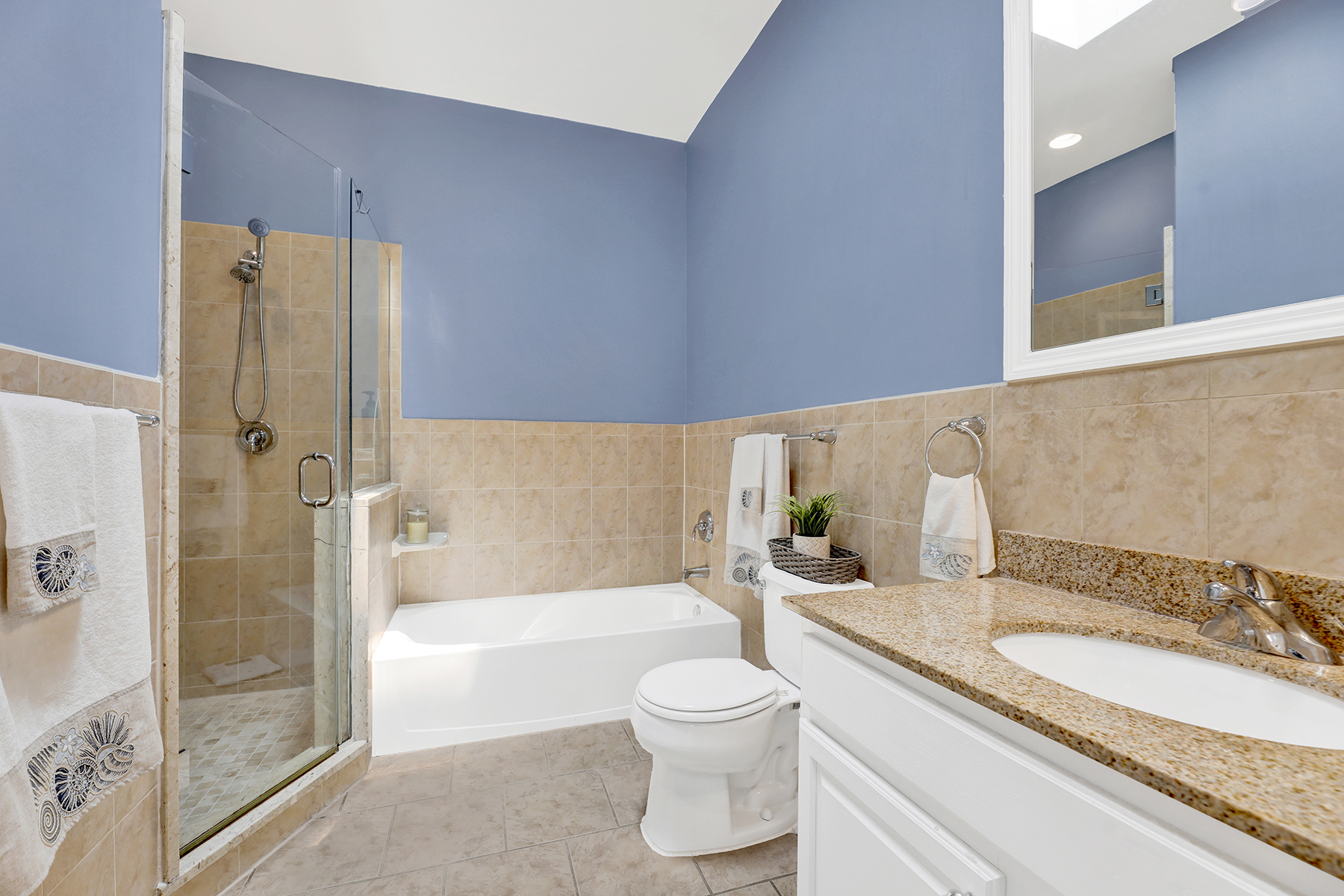 102-20 Rockaway Beach Boulevard, Unit 3C Queens, NY 11694 - Photo 25 of 36 a bathroom with a granite countertop sink a toilet and shower
