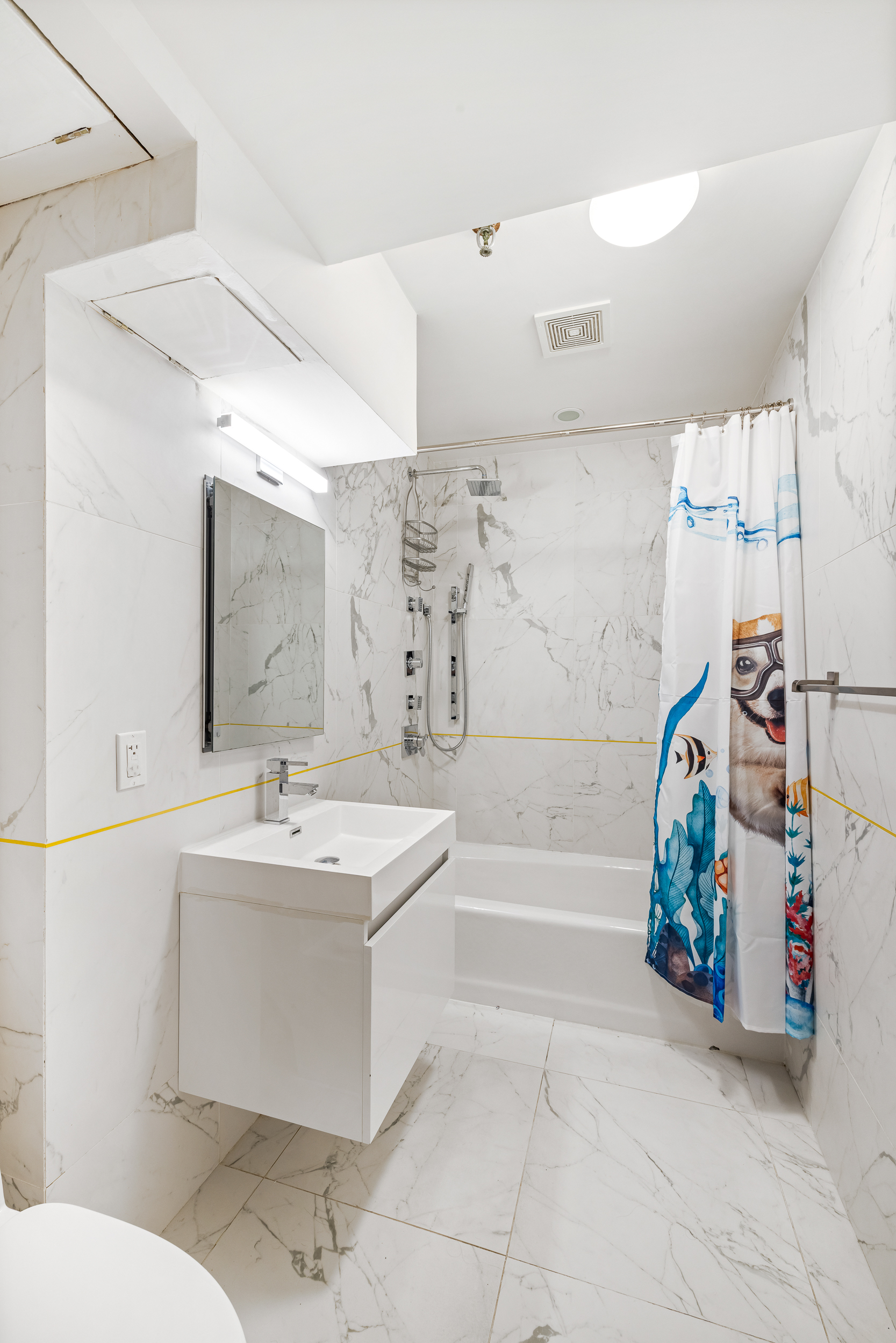 240 West 23rd Street, Unit 3/4C Manhattan, NY 10011 - Photo 10 of 13 a bathroom with a sink a toilet and shower