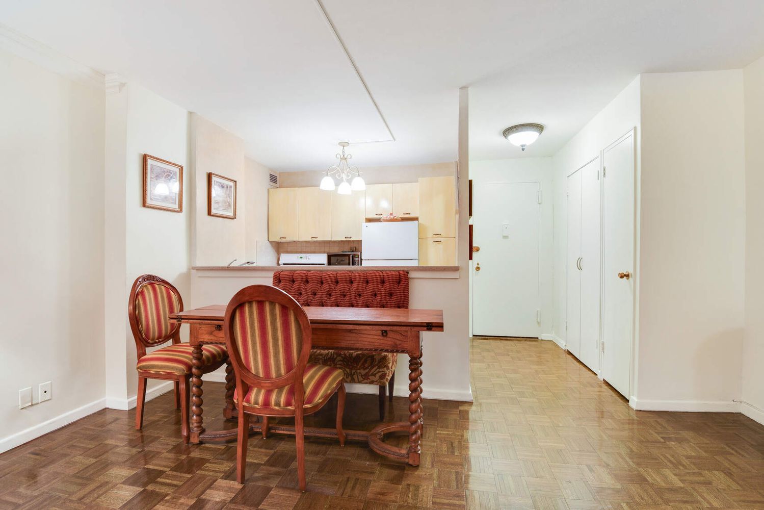 a dining room with furniture and window