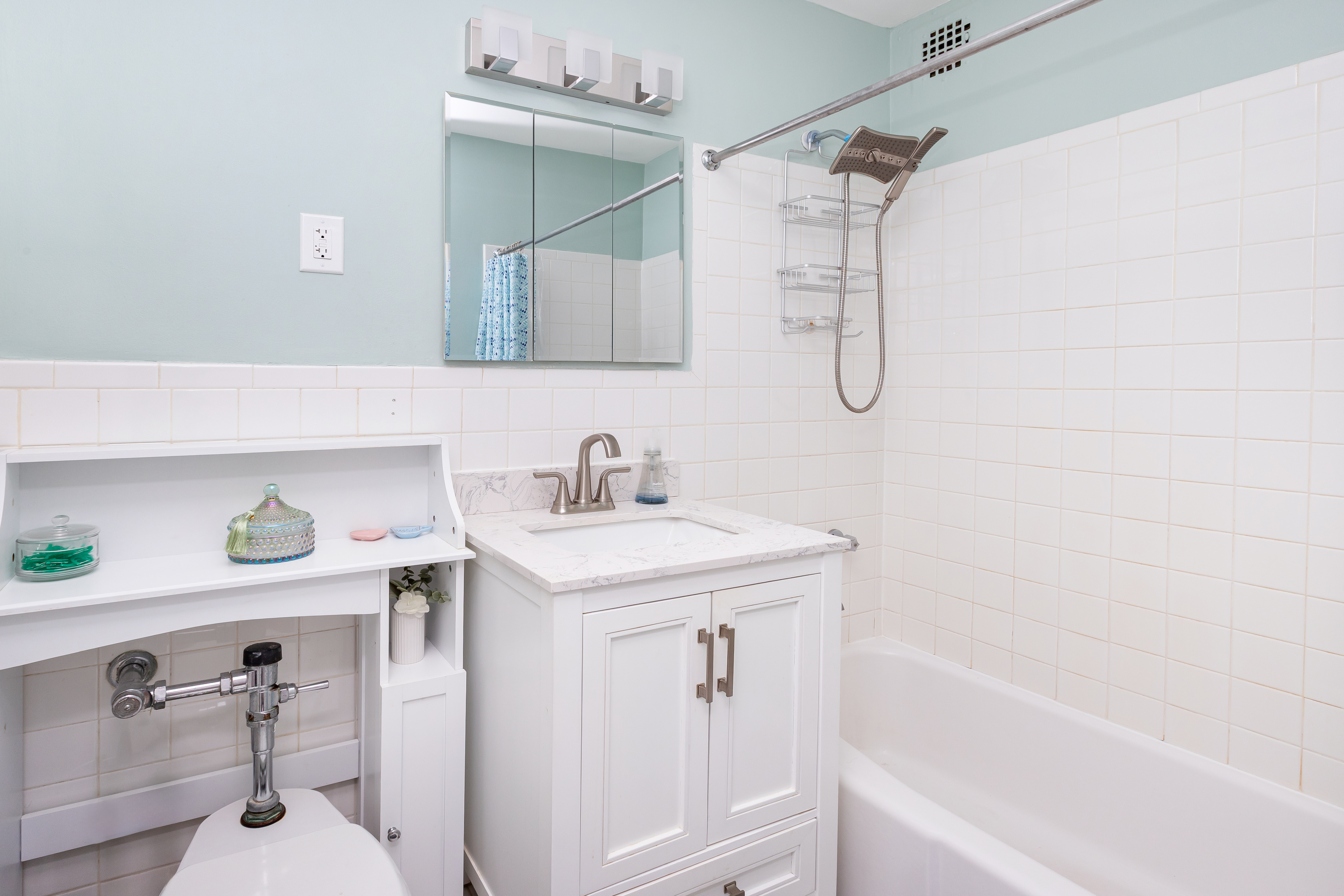 1270 East 51st Street, Unit 5B Brooklyn, NY 11234 - Photo 7 of 8 a bathroom with a sink a vanity and a bathtub