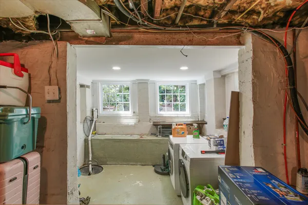 a workspace with kitchen area and a window