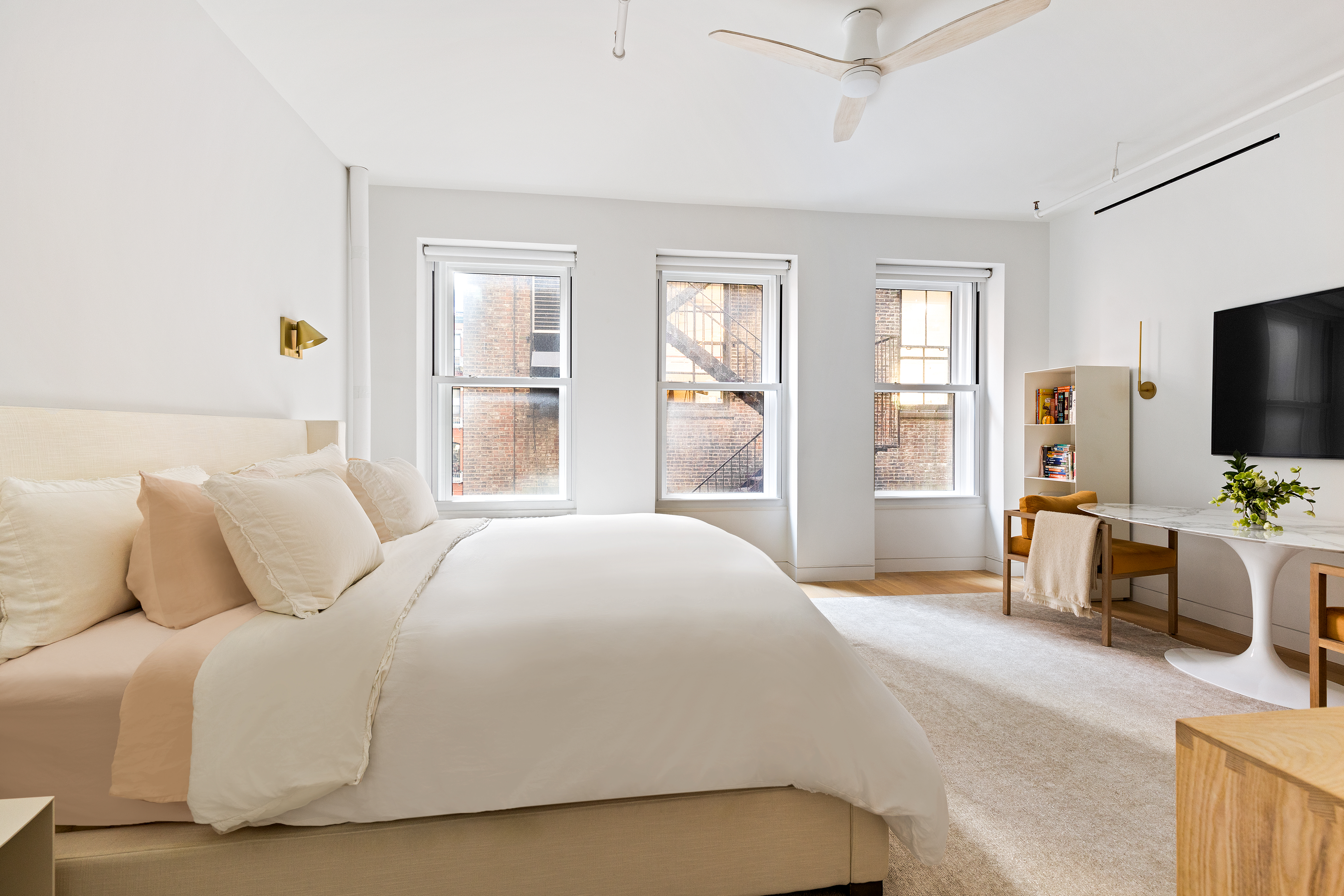 40 East 19th Street, Unit 7 Manhattan, NY 10003 - Photo 5 of 15 a bedroom with a bed and large windows