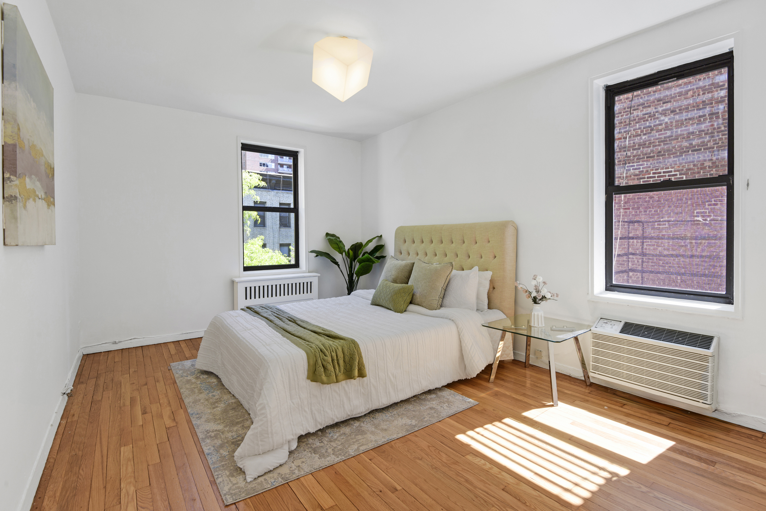 330 East 70th Street, Unit 4F Manhattan, NY 10021 - Photo 11 of 14 a bedroom with a bed and a window