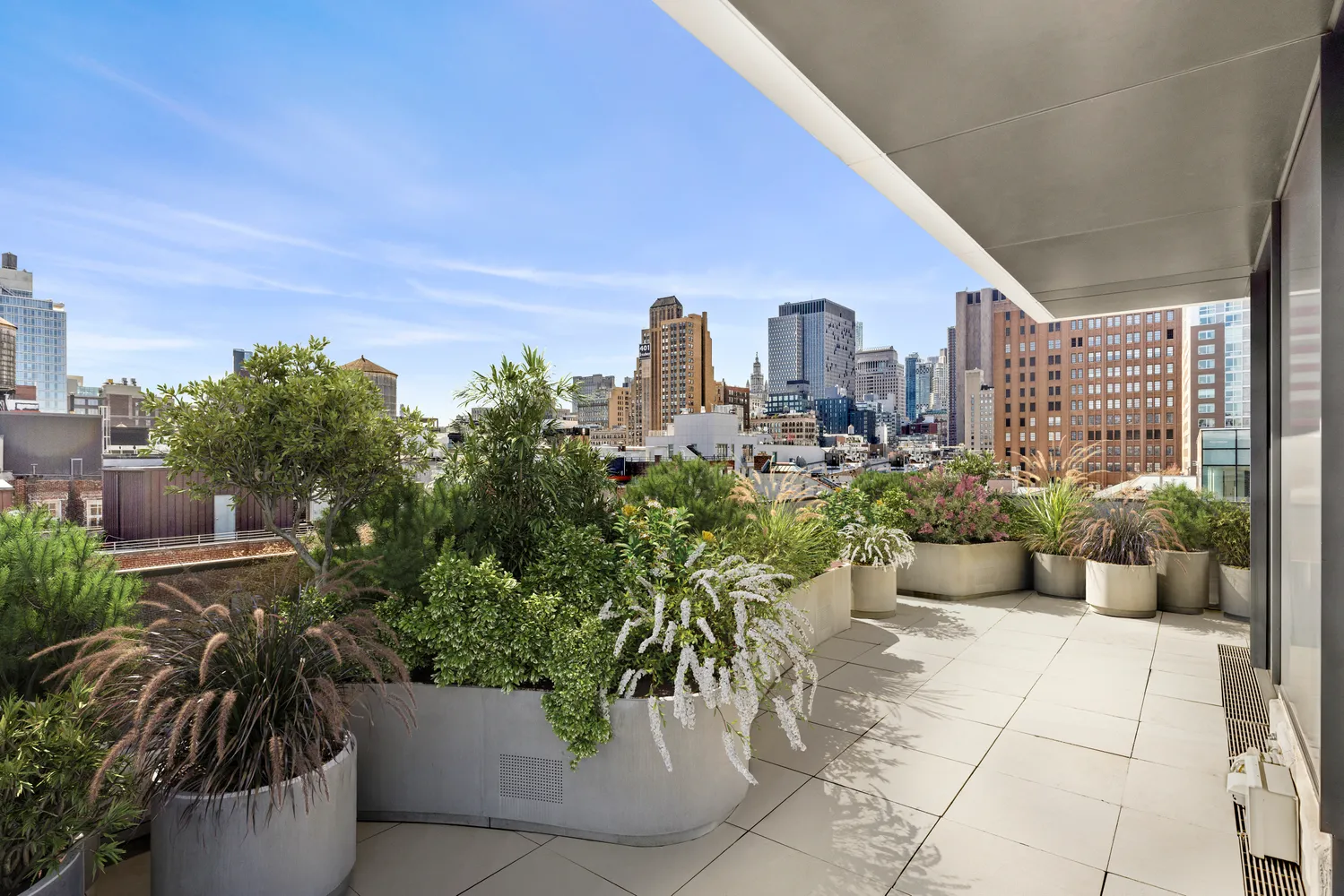 a view of a terrace with couches and potted plants