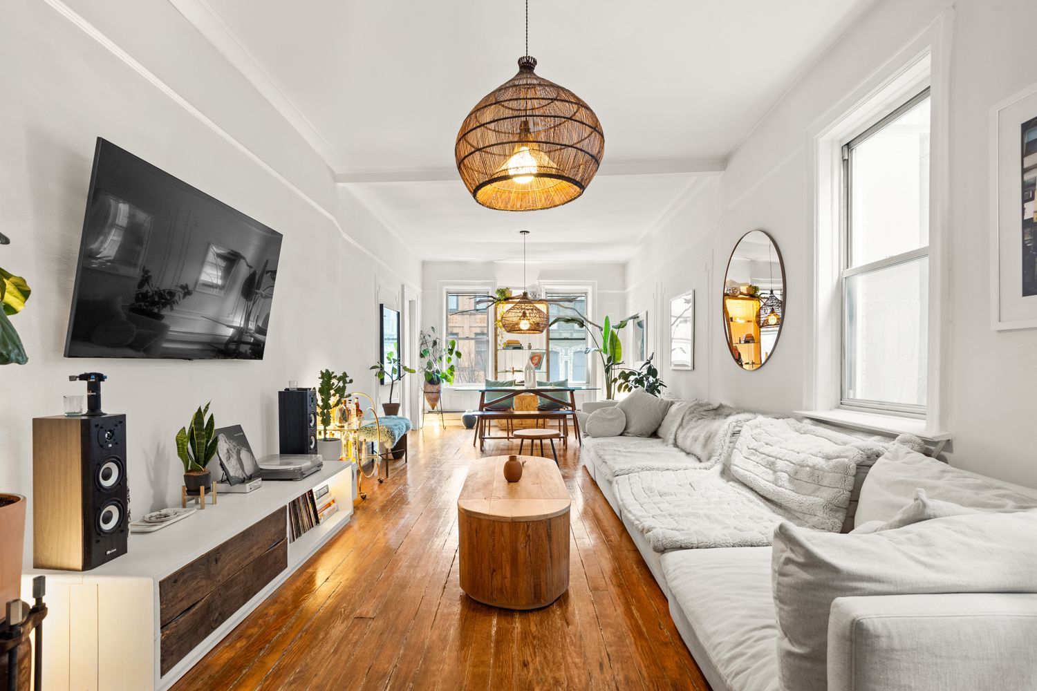 a living room with furniture and a flat screen tv