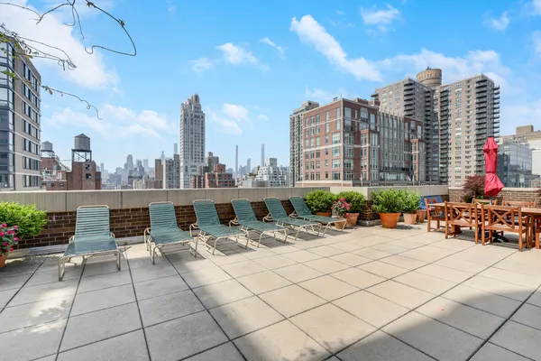 a view of a hallway with wooden shelves