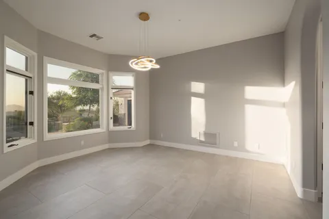 a view of a patio with couches table and chairs and potted plants