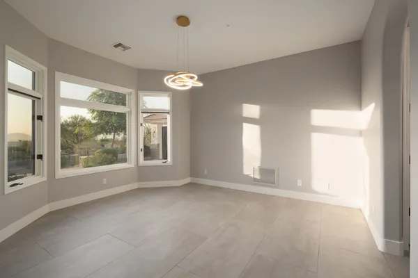 a view of a patio with couches table and chairs and potted plants