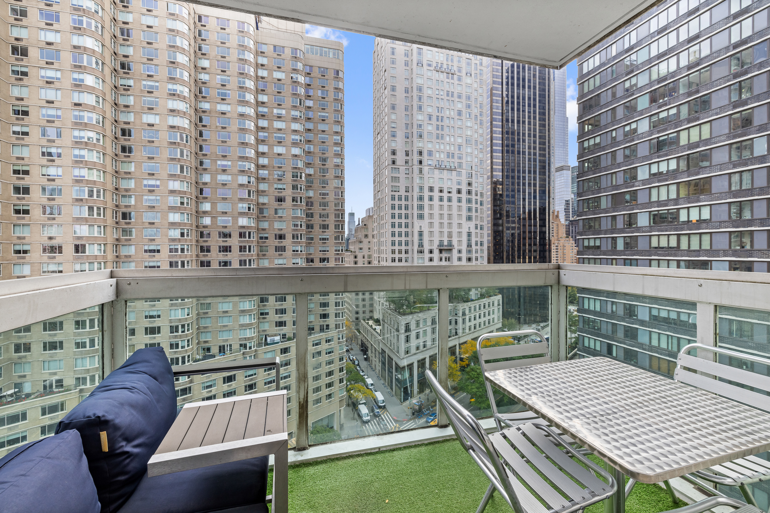 61 West 62nd Street, Unit 16D Manhattan, NY 10023 - Photo 5 of 11 a balcony view with a seating space