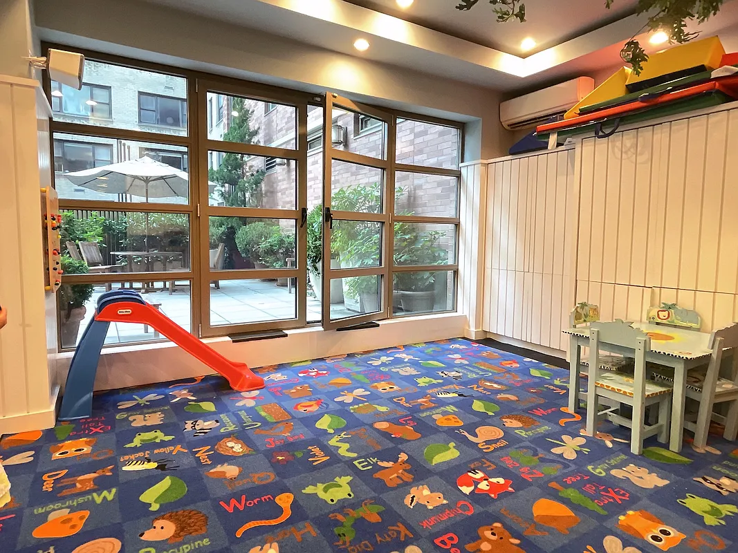 400 East 90th Street, Unit 15B Manhattan, NY 10128 - Photo 14 of 15 a bedroom with natural light and rug