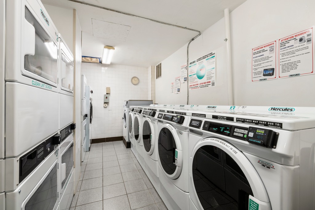 123 East 75th Street, Unit 6A Manhattan, NY 10021 - Photo 8 of 9 a view of a kitchen with washer and dryer