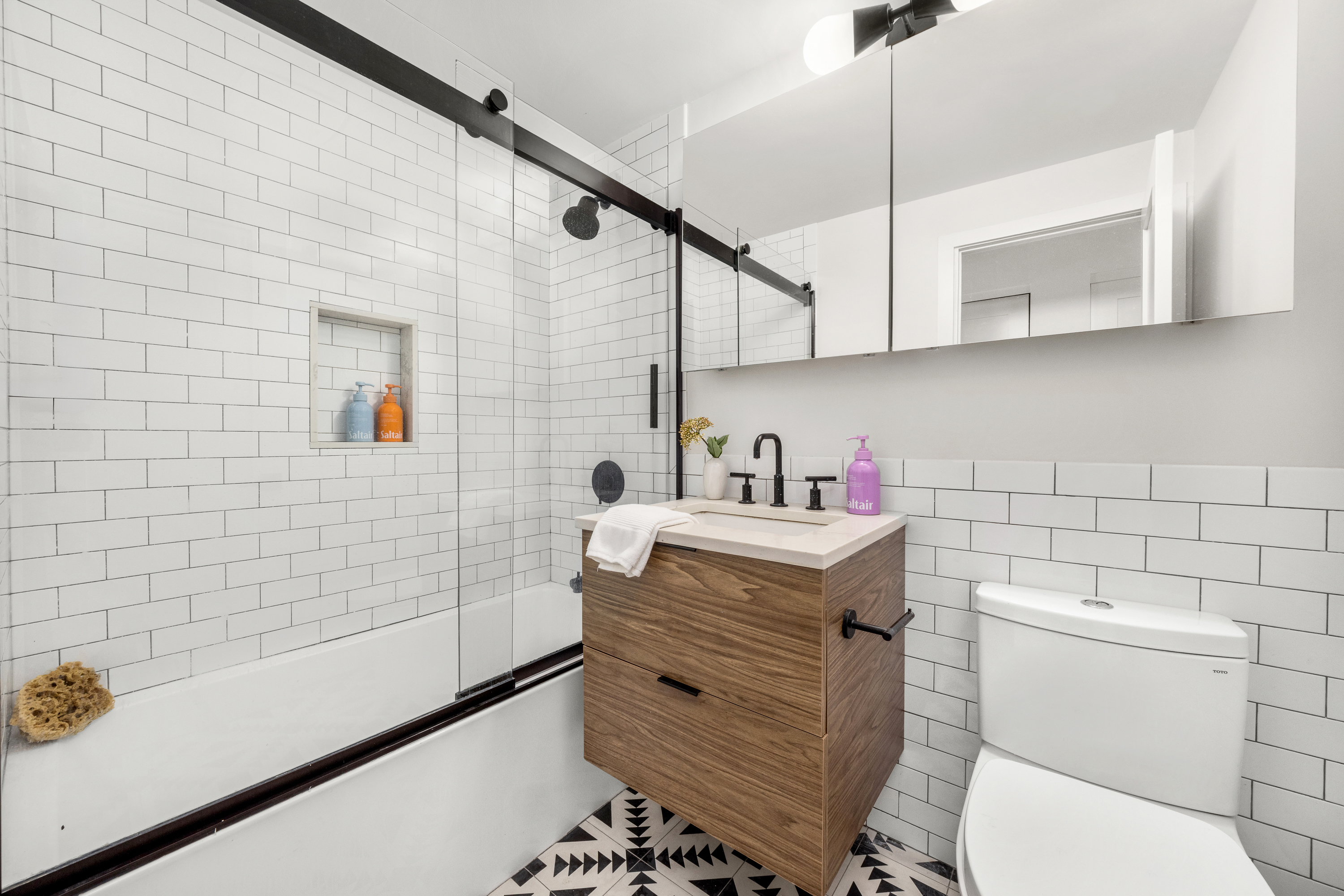 160 West 11th Street, Unit PH Manhattan, NY 10011 - Photo 12 of 16 a bathroom with a granite countertop sink a toilet and bathtub