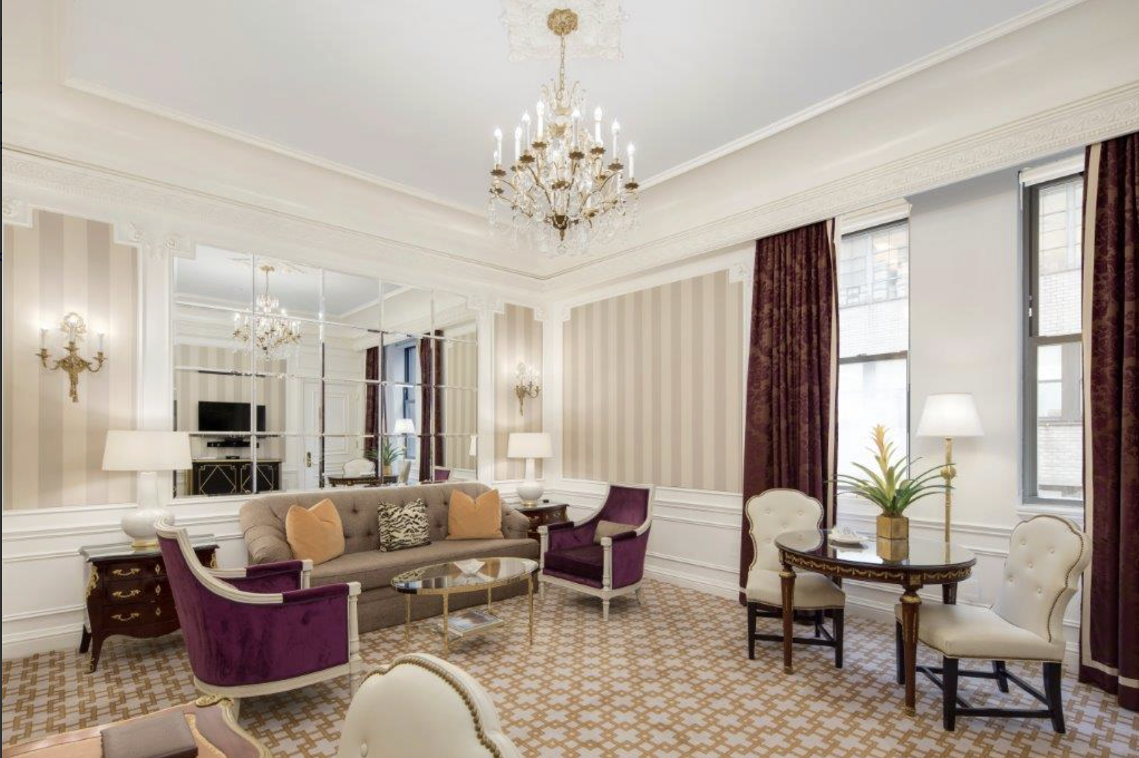 2 East 55th Street, Unit 936W39 Manhattan, NY 10022 - Photo 2 of 11 a living room with furniture potted plant and a chandelier