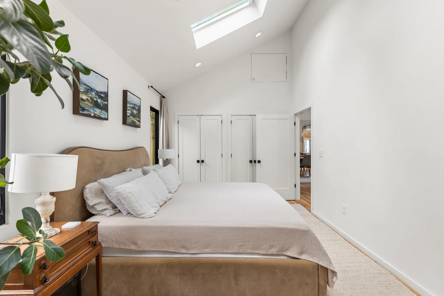 a bedroom with a bed and a lamp