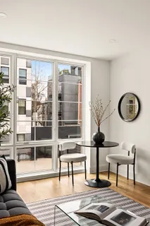 a view of a livingroom with furniture and front door