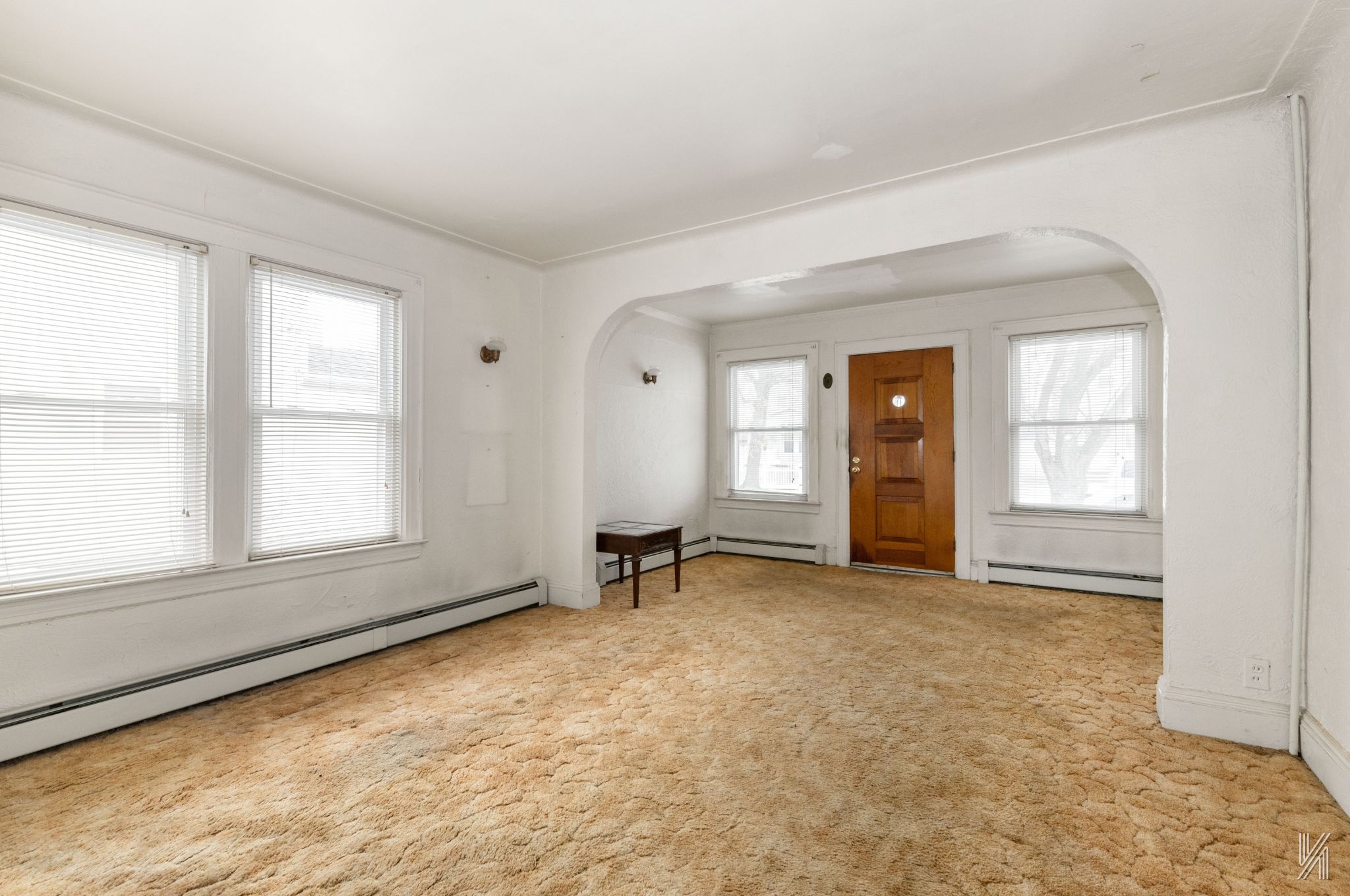 135-16 95th Street Queens, NY 11417 - Photo 3 of 21 an empty room with windows and closet