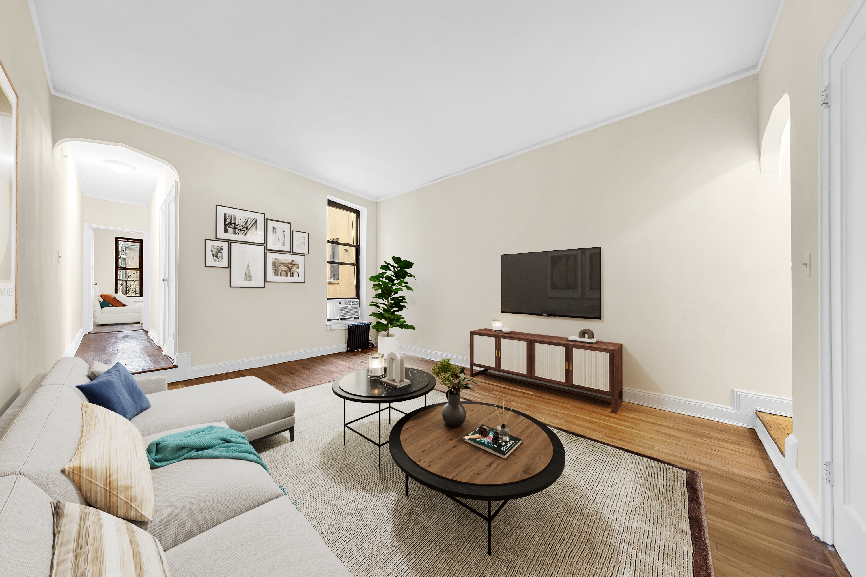 370 Columbus Avenue, Unit 5D Manhattan, NY 10024 - Photo 2 of 10 a living room with furniture and a flat screen tv