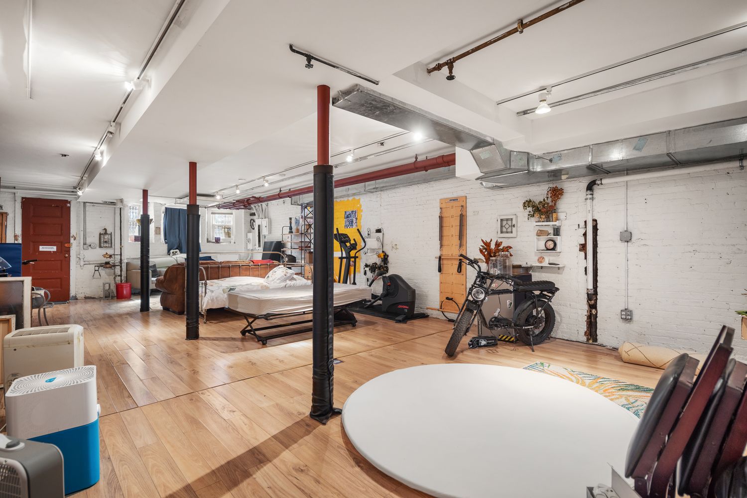 a view of a backyard with sitting area and garden