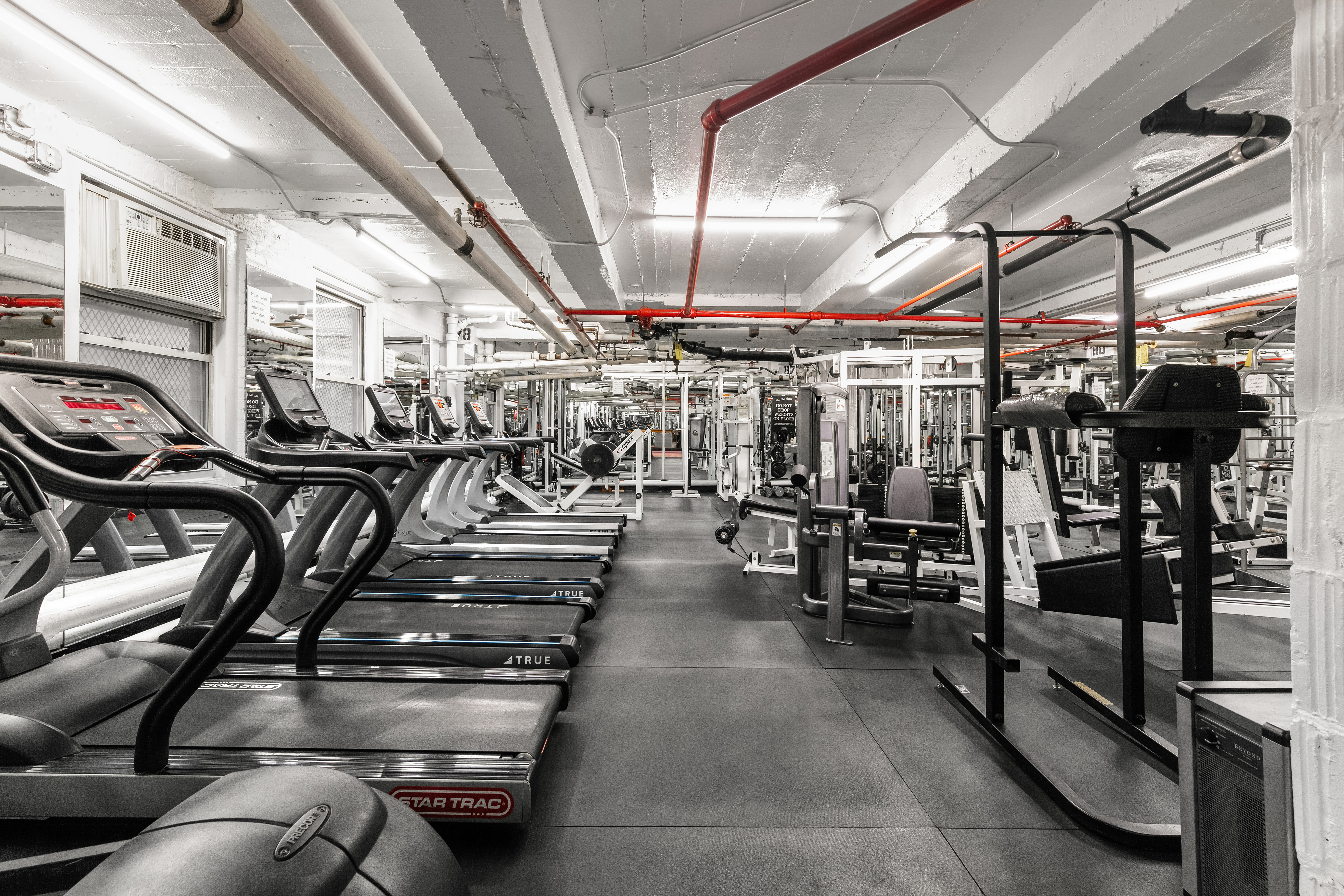 333 East 43rd Street, Unit 110/111 Manhattan, NY 10017 - Photo 7 of 16 a view of a room with gym equipment