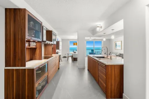 a kitchen with stainless steel appliances granite countertop a sink and cabinets