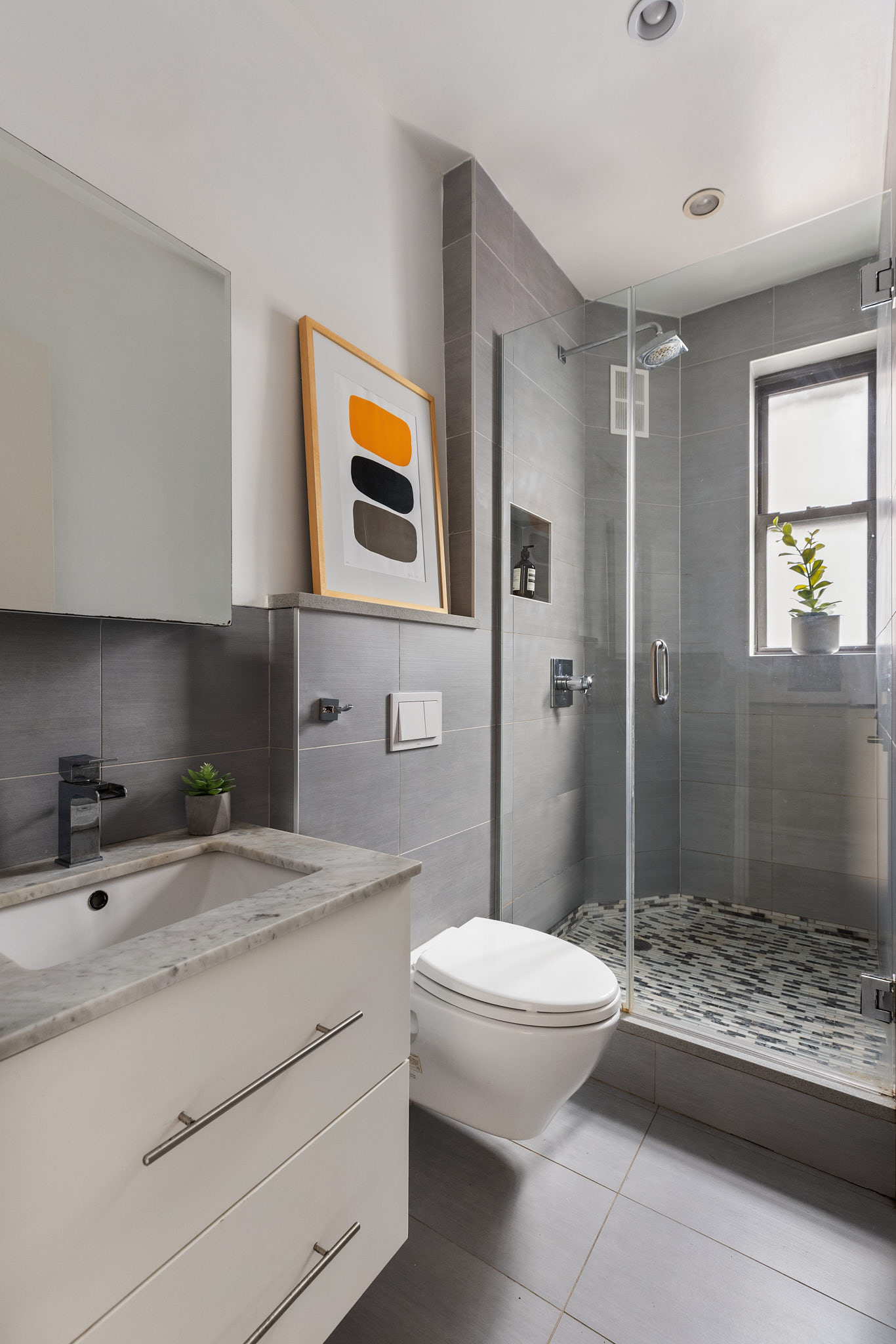 340 West 19th Street, Unit 20 Manhattan, NY 10011 - Photo 7 of 8 a bathroom with a sink a toilet and shower