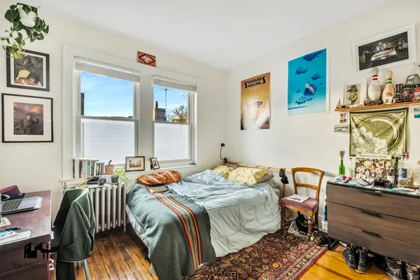 a bedroom with a bed and a table in it