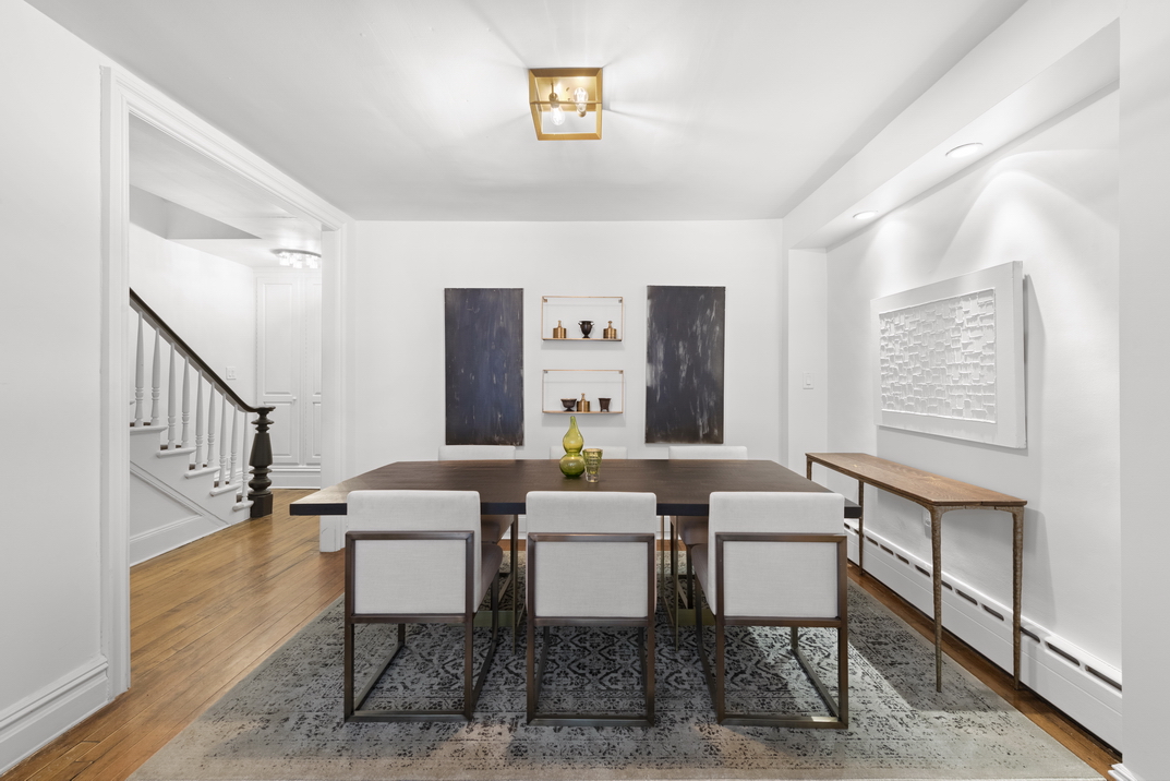 209 East 61st Street Manhattan, NY 10065 - Photo 20 of 24 a dining room with furniture and window