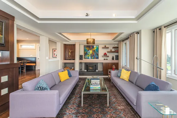 a living room with furniture and a rug