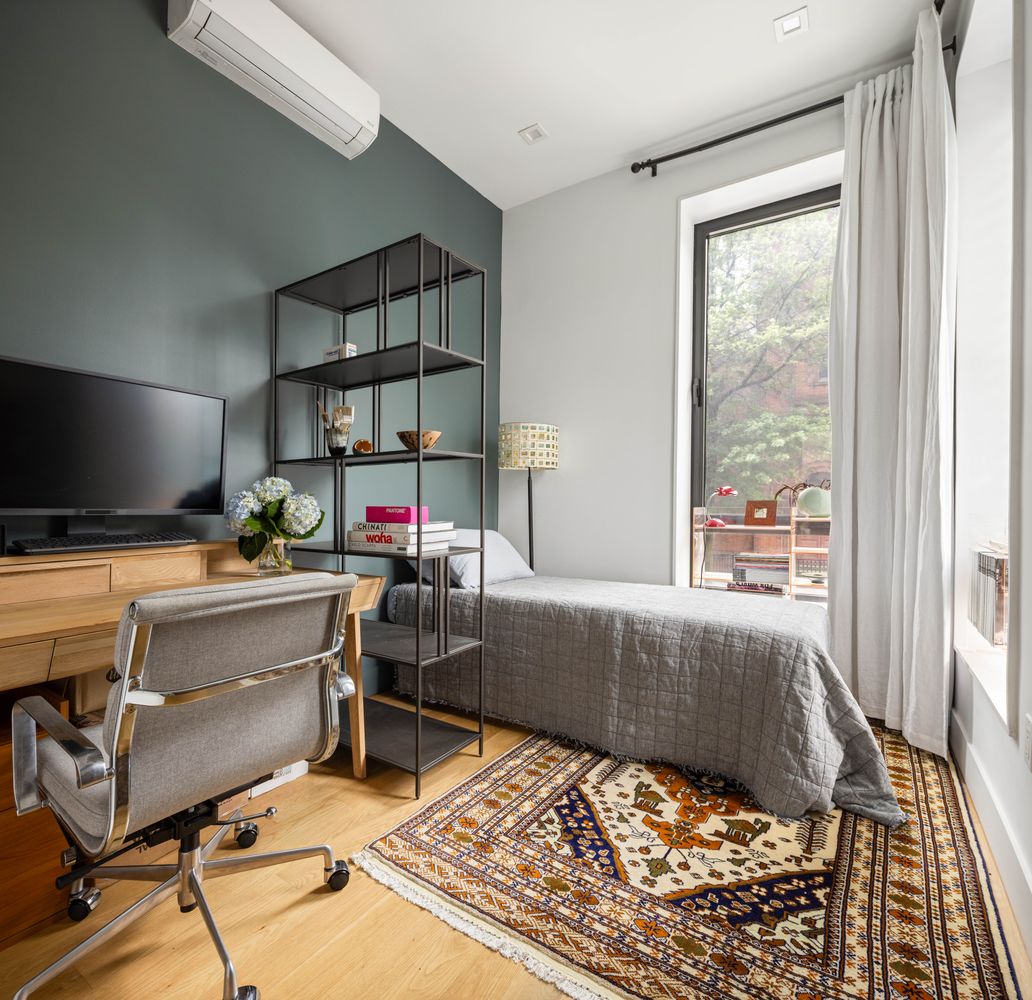 315 South 5th Street, Unit 2 Brooklyn, NY 11211 - Photo 7 of 9 a living room with a rug and a flat screen tv