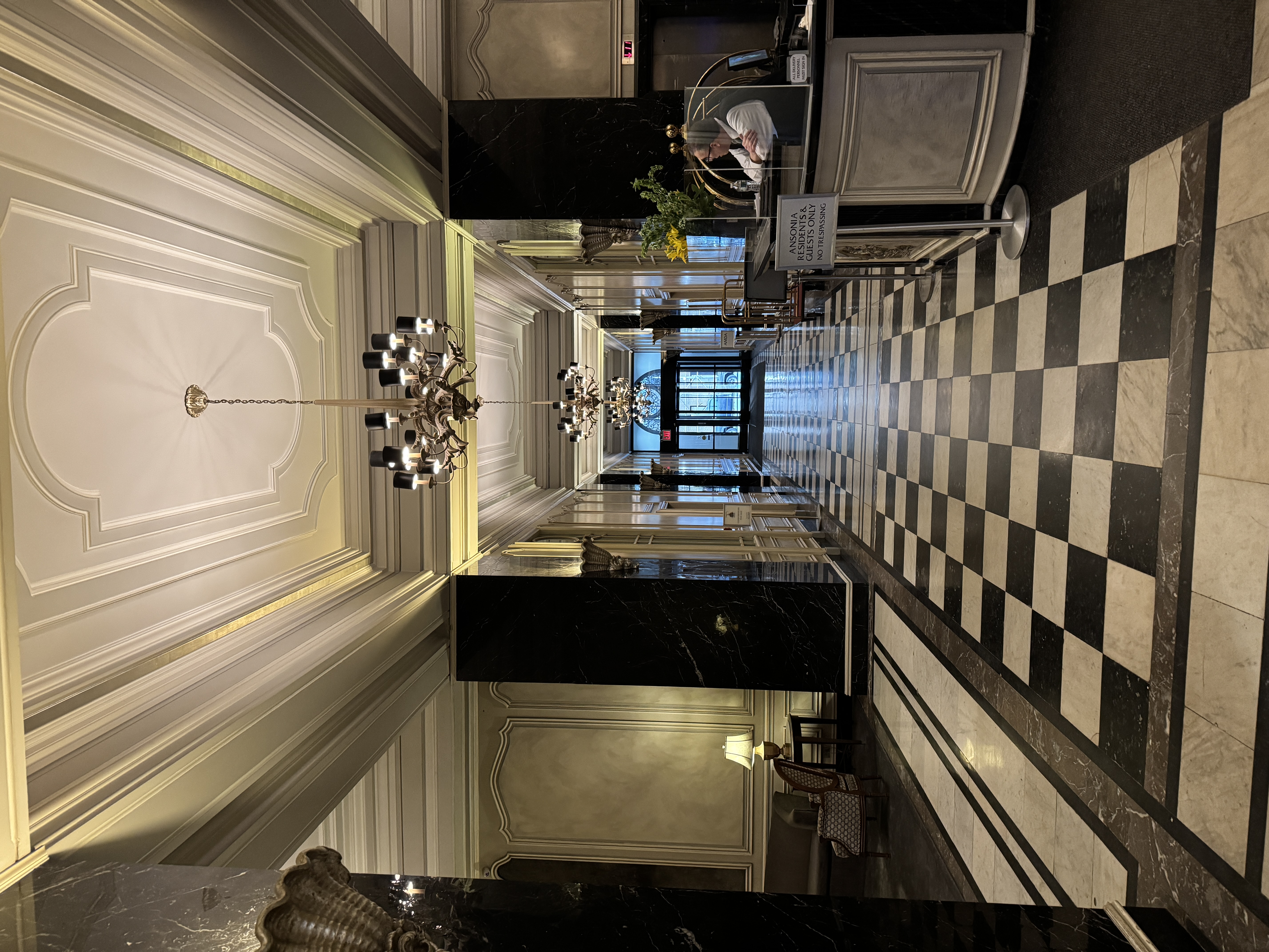 2109 Broadway, Unit 4126 Manhattan, NY 10023 - Photo 12 of 18 a lobby with furniture and a chandelier