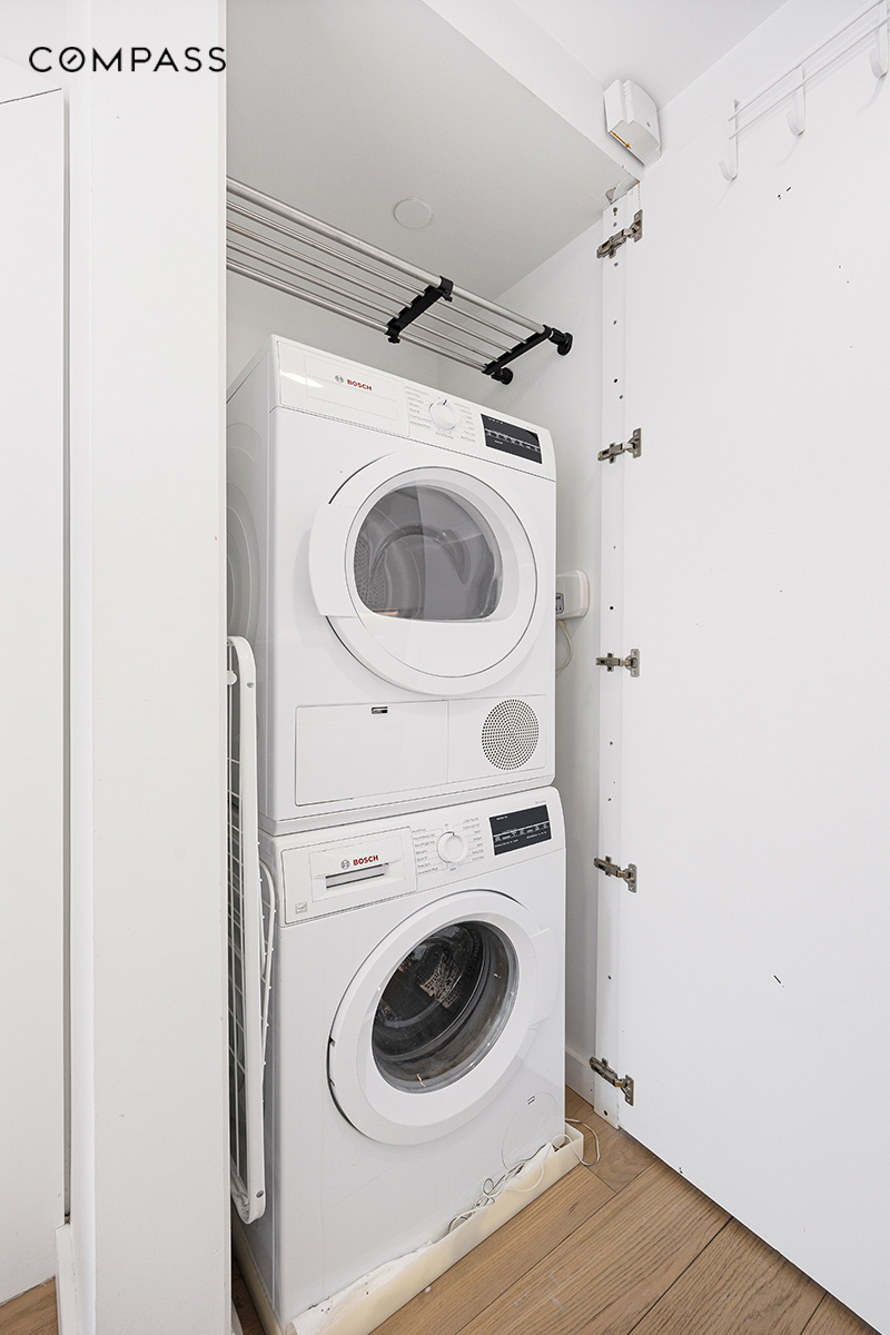 1790 3rd Avenue, Unit 1004 Manhattan, NY 10029 - Photo 8 of 9 a utility room with dryer and washer