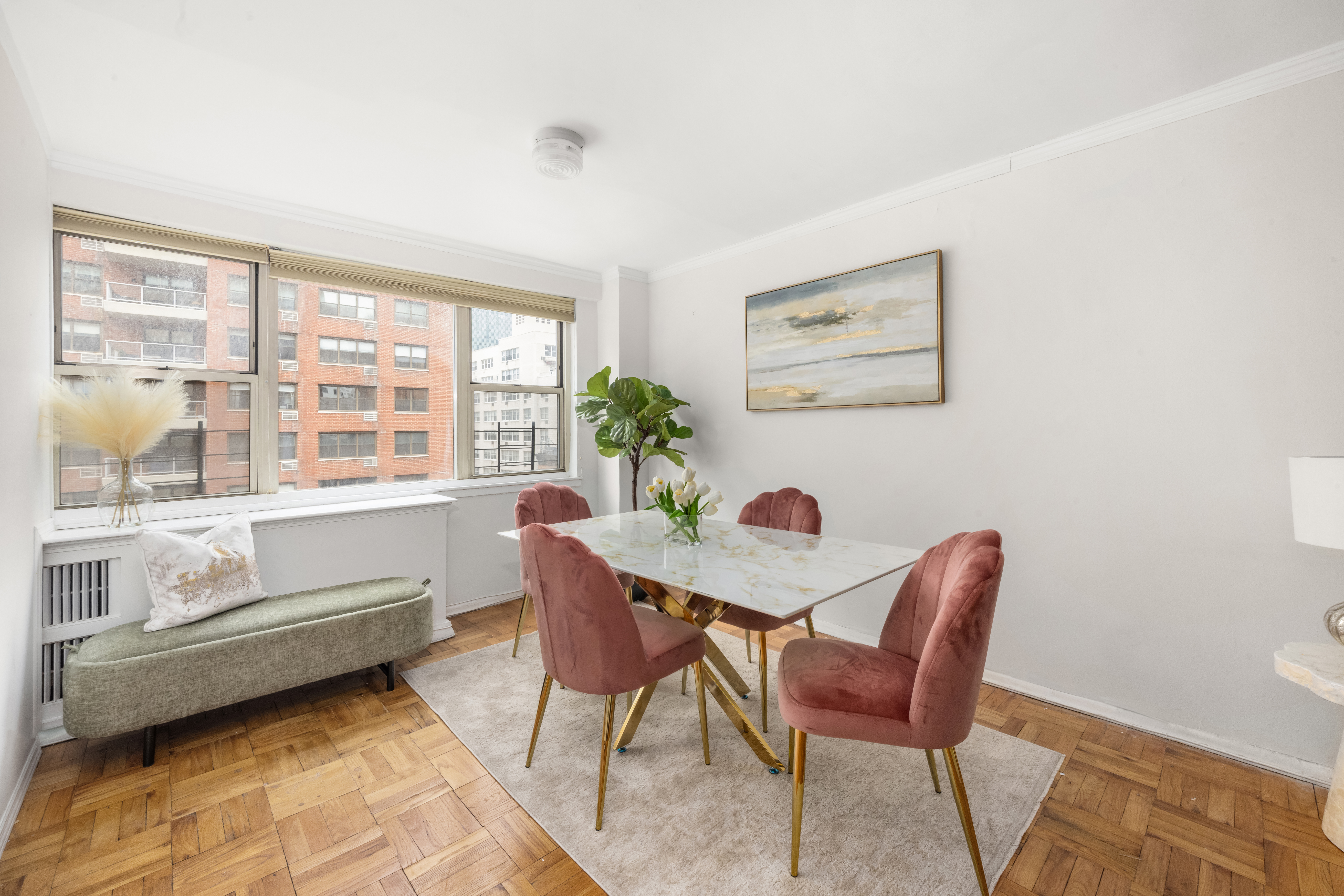 233 East 70th Street, Unit 8T Manhattan, NY 10021 - Photo 3 of 9 a dining room with furniture and window