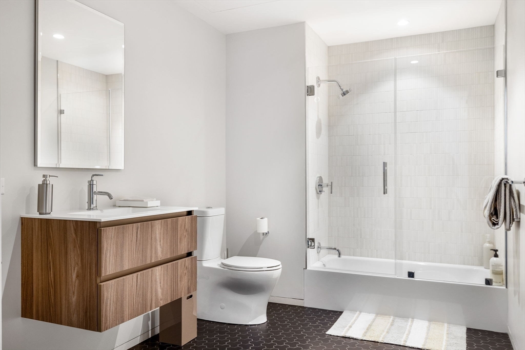 10 Farnsworth Street, Unit 3A Boston, MA 02210 - Photo 23 of 31 a bathroom with a toilet a sink and shower