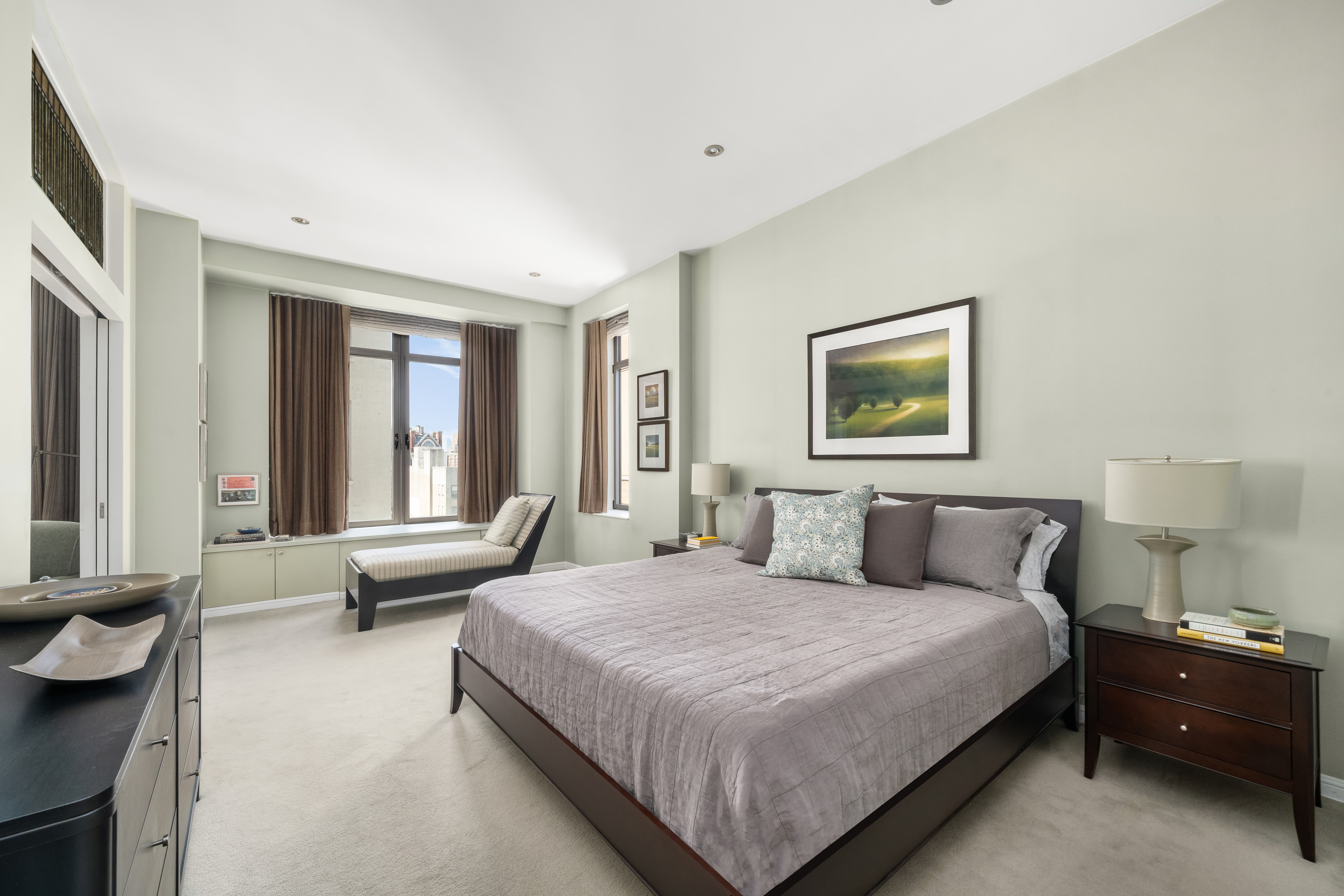 252 7th Avenue, Unit 9D Manhattan, NY 10001 - Photo 15 of 23 a bedroom with a bed and a couch