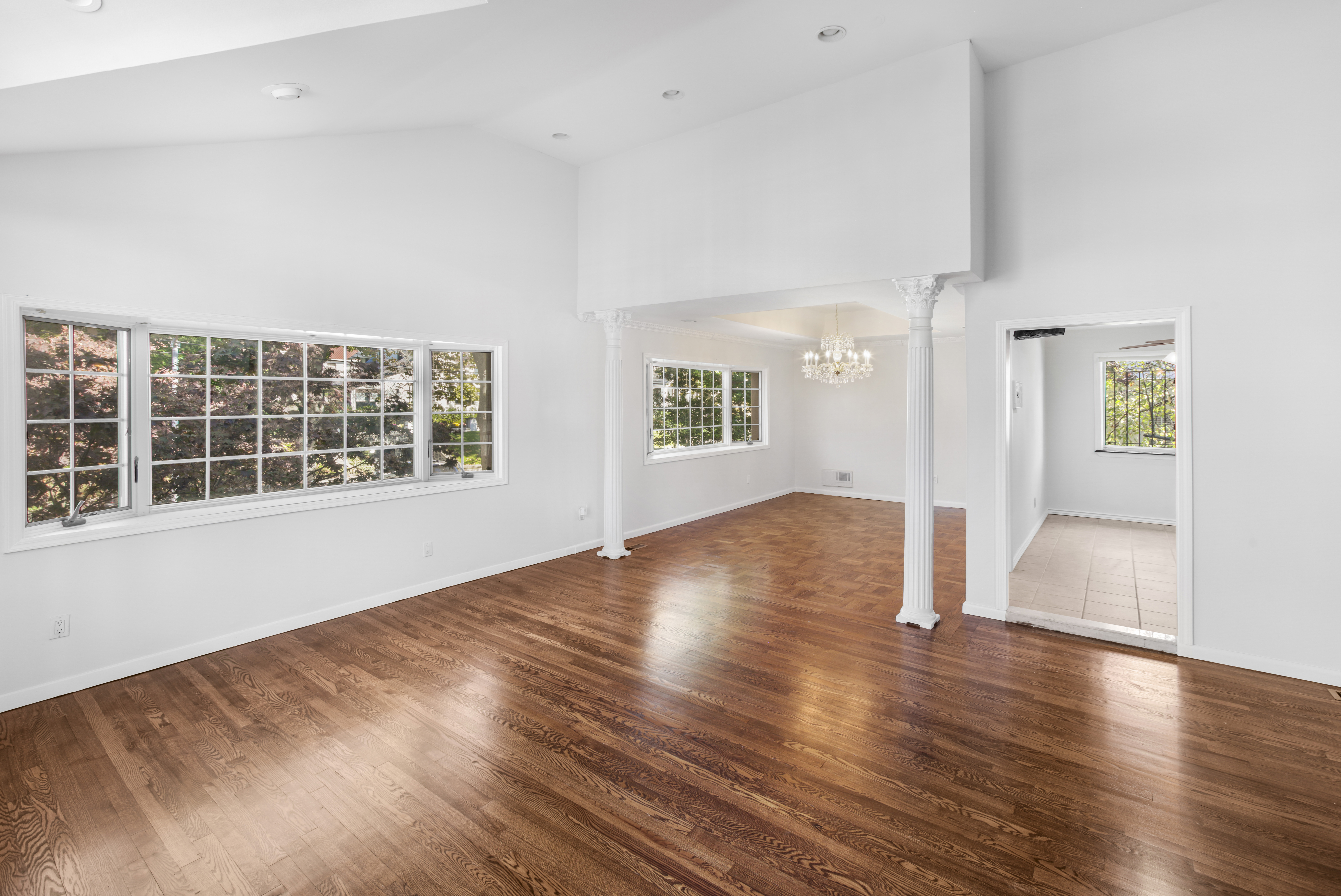60 82nd Street Brooklyn, NY 11209 - Photo 5 of 19 an empty room with wooden floor and windows