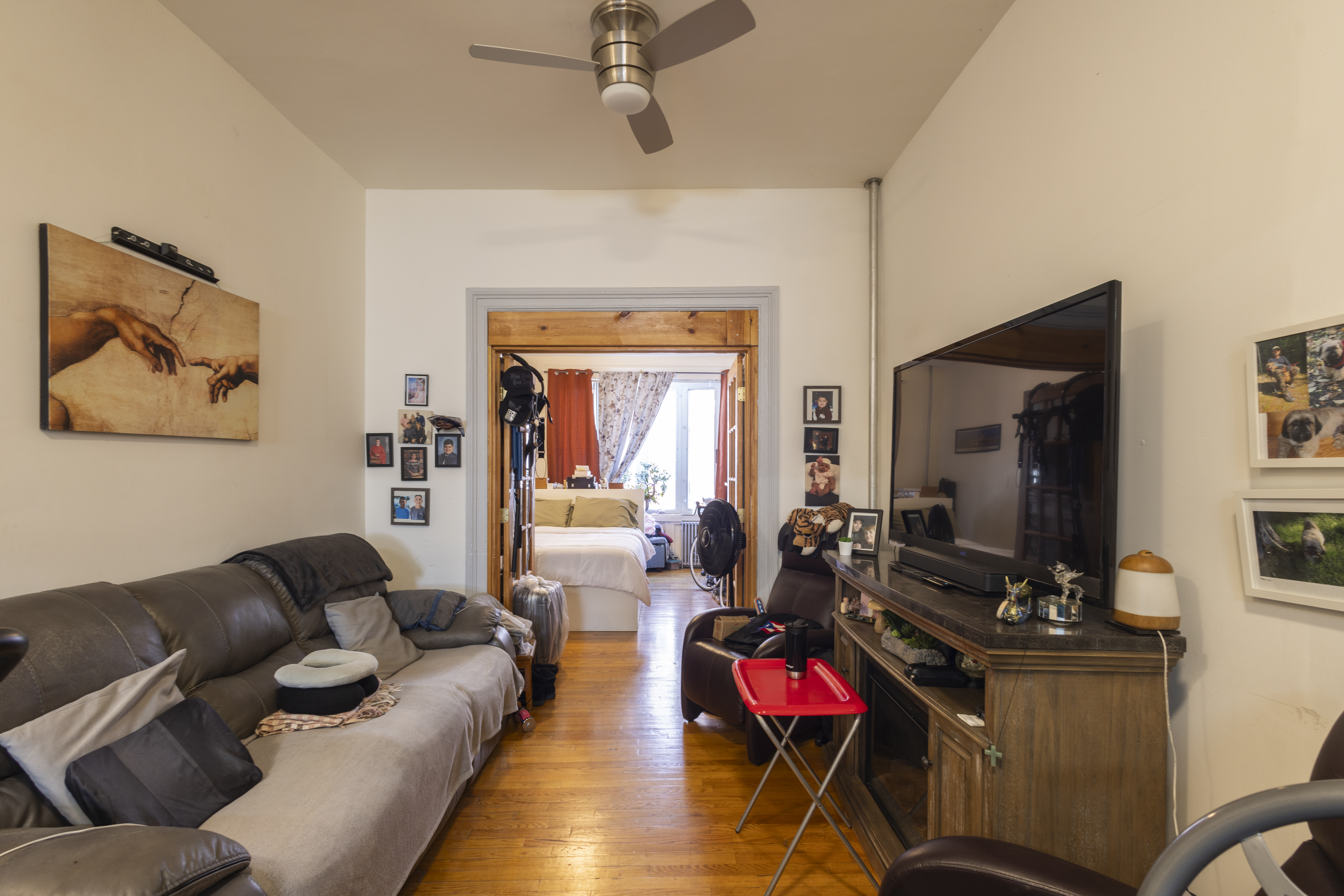 40 A Jewel Street Brooklyn, NY 11222 - Photo 3 of 18 a living room with furniture gym equipment and a flat screen tv