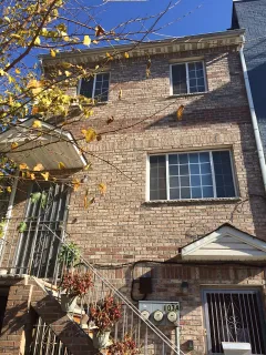 a front view of a house with parking