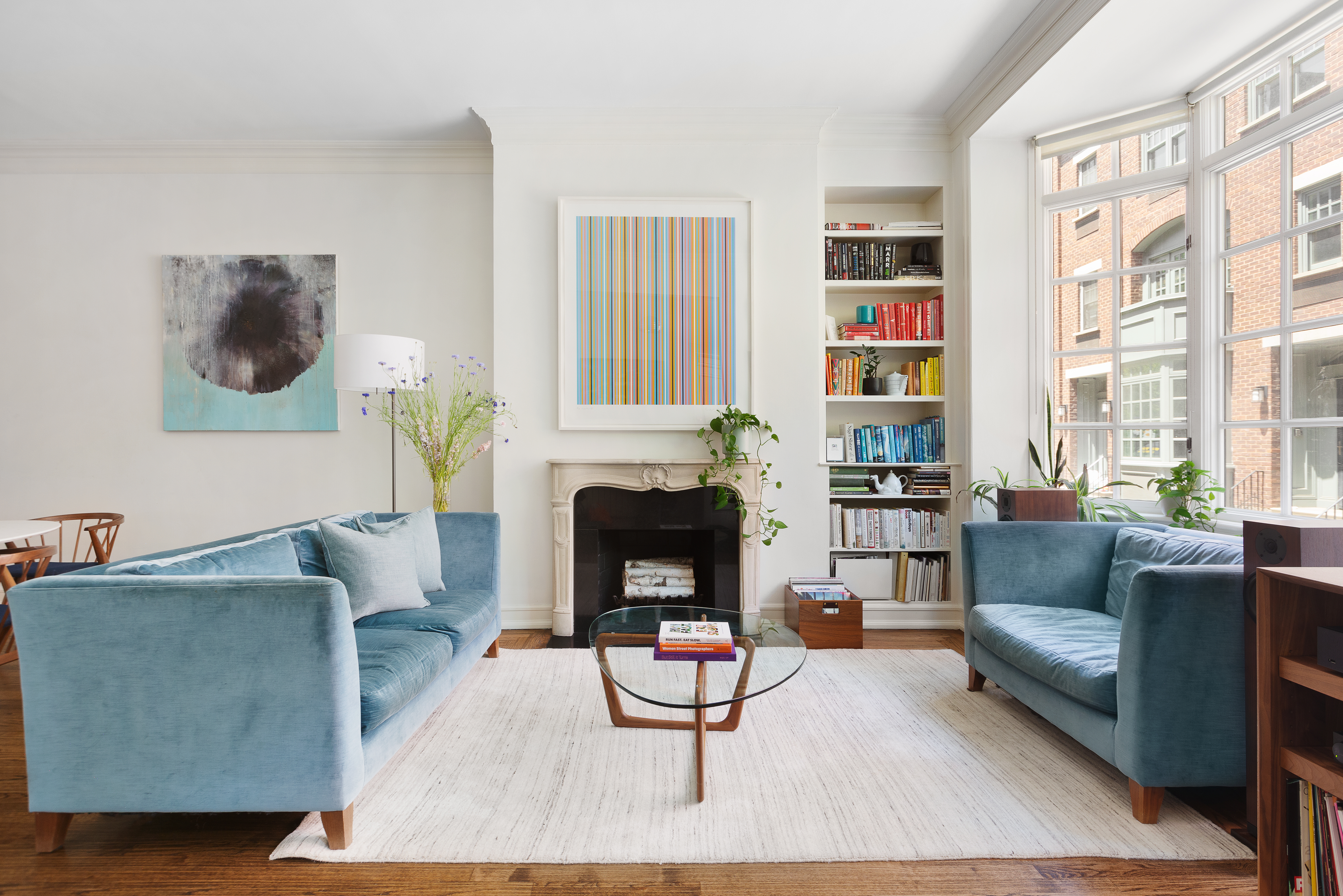 687 Greenwich Street, Unit TH7 Manhattan, NY 10014 - Photo 1 of 23 a living room with furniture and a fireplace
