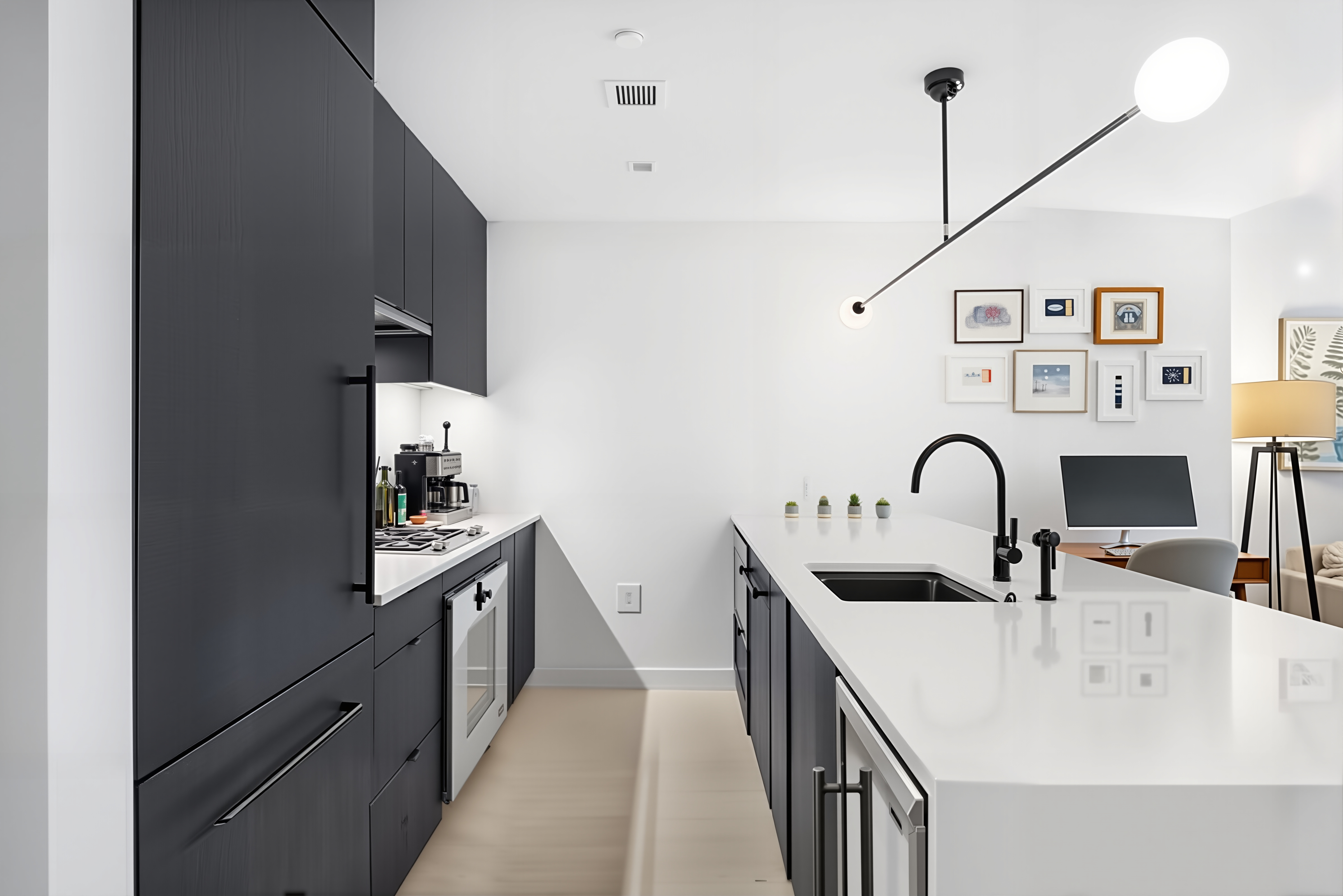 55 West 17th Street, Unit 502 Manhattan, NY 10011 - Photo 3 of 6 a kitchen with stainless steel appliances a sink a stove top oven a counter space and cabinets