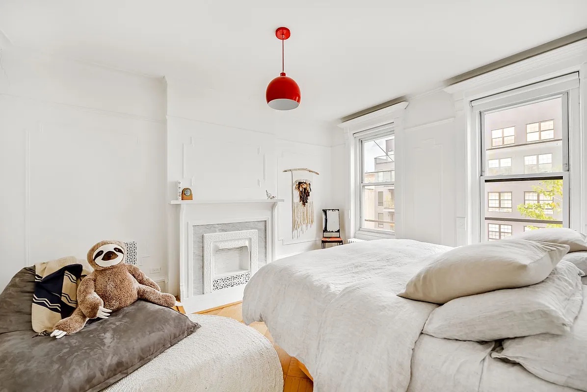 611 Macon Street Brooklyn, NY 11233 - Photo 8 of 12 a bedroom with 2 bed and a window