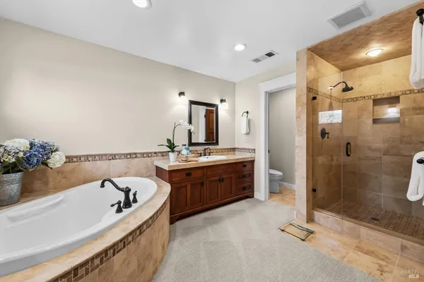 a view of a road with large trees