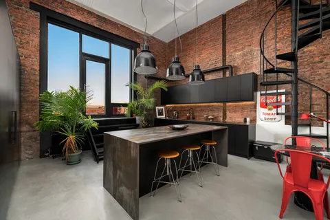 a bedroom with bed and night stand