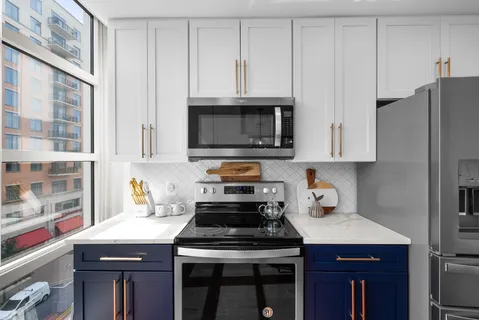 a kitchen with counter top space and sink